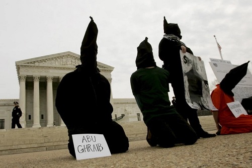 District of Columbia Anti-War Network activists take part in a demonstration to oppose "American violations of international human rights" at the Abu Ghraib Prison in Iraq by US military personnel in front of the US Supreme Court in this February 9, 2005 file photo