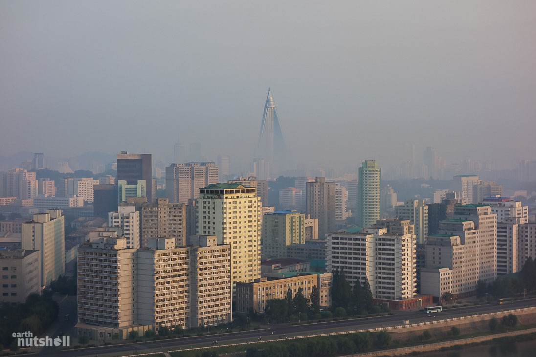 The morning skyline of North Korea’s capital city, Pyongyang. This photo was taken from the Yanggakdo Hotel. The pointed building is the unopened Ryugyong Hotel.