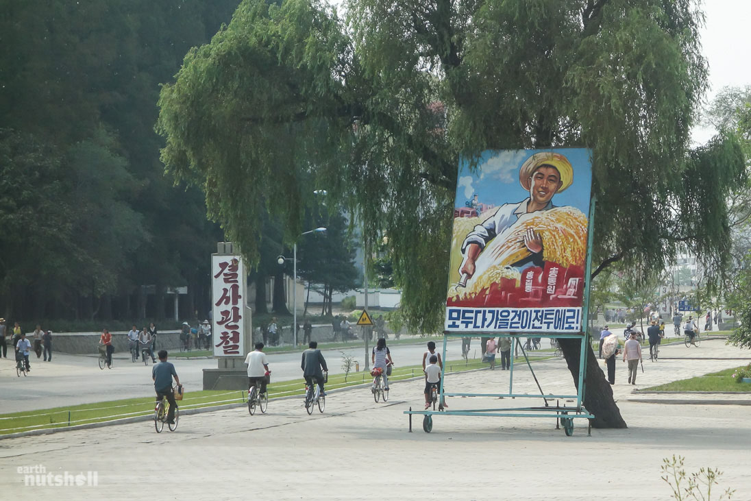 “Total concentration, total mobilisation. All head to the harvest battle!” A propaganda billboard motivating this years ‘harvest battle’, a campaign where soldiers, office workers, labourers and even elementary school students are mobilised into the countryside for farm work. This is to boost agriculture productivity before winter hits. I took this photo in the rarely visited city of Haeju. Very few foreigners have been here.