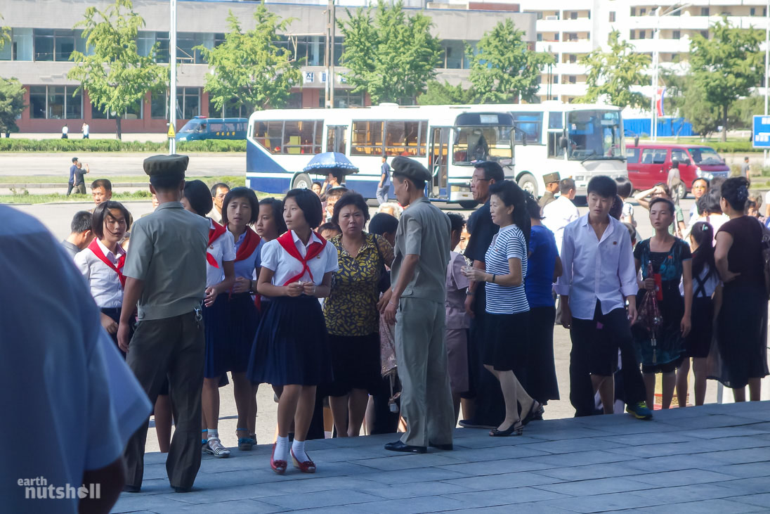 Locals receiving instruction outside the Pyongyang Military Circus.