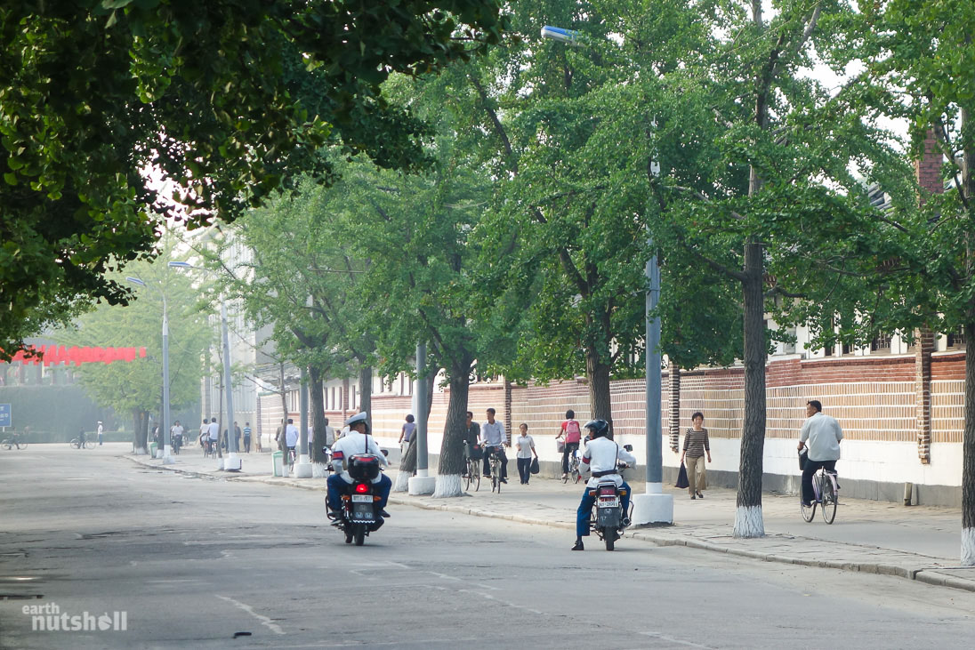 Police officers having a discussion on the streets of Kaesong.