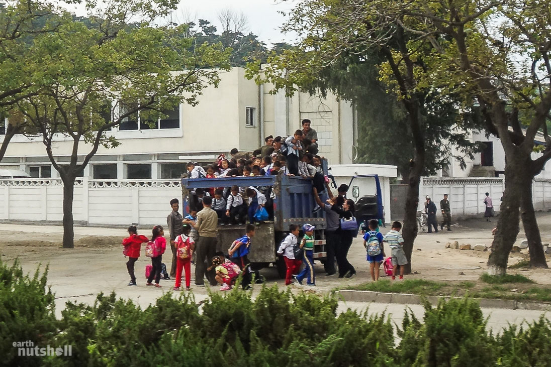 The local school bus. Children stack on top of one another for transit.