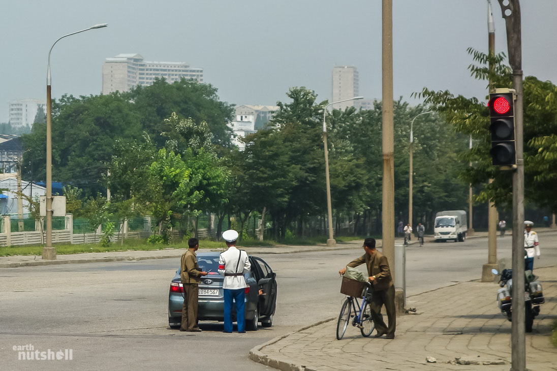 A local in Pyongyang chatting to a police officer after being pulled over.