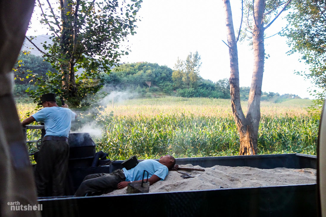 Taking a nap on the back of a moving coal powered truck.