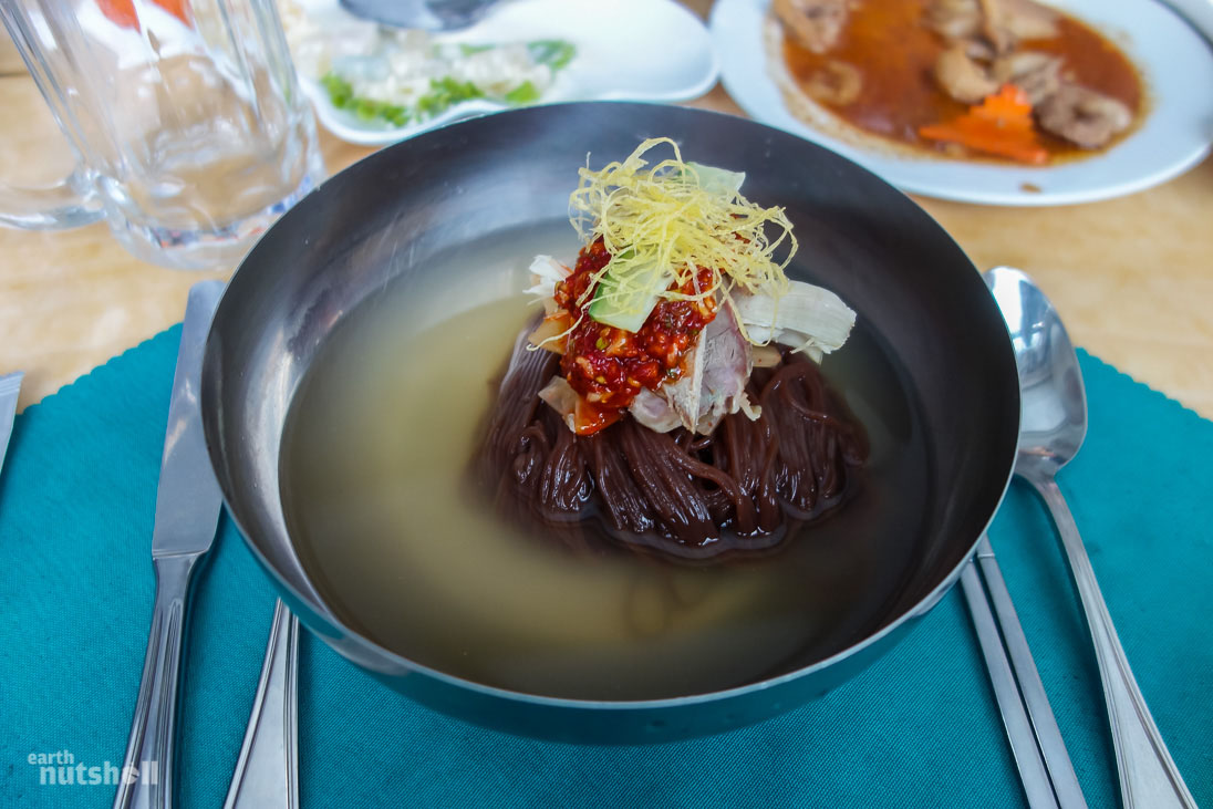  Naengmyeon noodles, a delicacy originating in Pyongyang. It’s a dish served cold with dressing and red chilli paste. It’s quite tasty but difficult to eat with chopsticks.