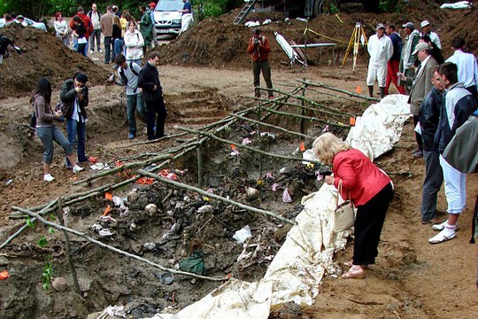   Delegates of the International Association of Genocide Scholars (IAGS) examine an exhumed mass grave of victims of the July 1995 Srebrenica massacre, outside the village of Potočari, Bosnia and Herzegovina. July 2007.