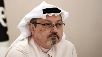 Jamal Khashoggi, looks on during a press conference in the Bahraini capital Manama, on December 15, 2014.